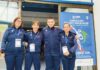 Atleti del Garda Karate Team davanti al pannello del Campionato Italiano Parakarate al Palasport di Marcon