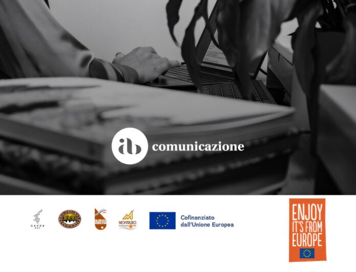 Manifesto di Consorzio Garda DOC mostra ufficio con computer e simboli istituzionali