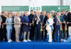 Manifesto della 98ª Fiera Agricola Zootecnica Italiana al Centro Fiera di Montichiari con persone che tagliano il nastro