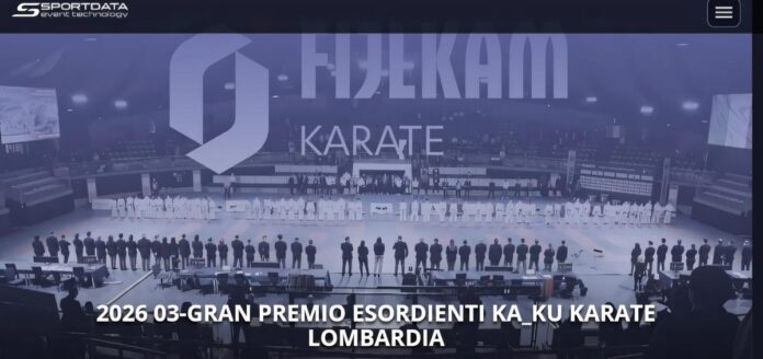 Scena di gara nel palazzetto dello sport a Brembate di Sopra con atleti in posizioni di partenza