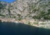 La spesa dei turisti stranieri nel 2025: Verona cresce, Brescia e Trento perdono terreno Panorama di Limone sul Garda con le montagne a picco sul lago